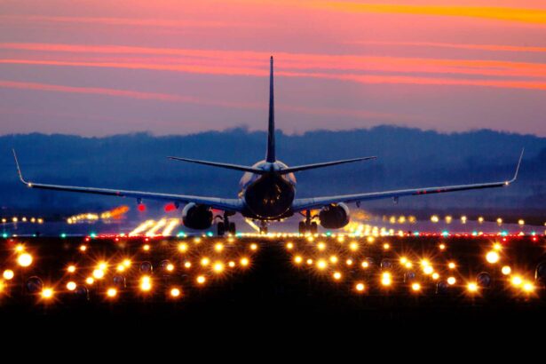 airliner on runway at sunset