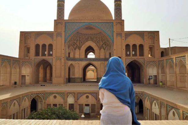 woman prays in Iran