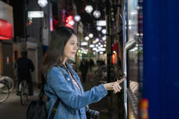 woman operates a vending machine